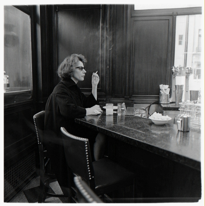 Diane Arbus, Woman at a counter smoking, N.Y.C., 1962