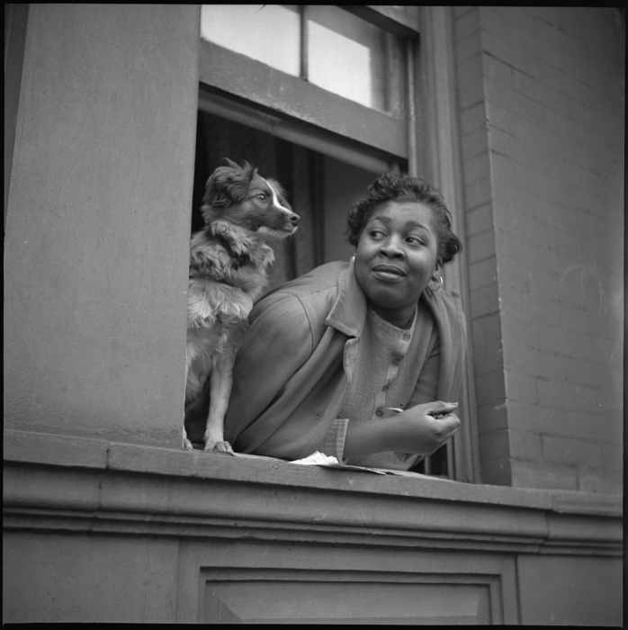 Gordon Parks, Woman and Dog in Window, Harlem, New York, 1943